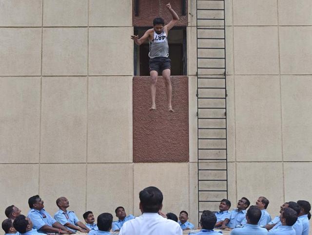 Mumbai, India - Aug. 23, 2016:A man jumps from 20 feet height during jumping sheet event at Fire Brigade recruitment drive at Borivali in Mumbai, India, on Tuesday, August 23, 2016. Candidates go through various physical tests during recruitment and get selected for training after the result of recruitment drive. After training for 6 months, 774 posts of firemen will get fulfilled through merit. (Photo by Pratham Gokhale/ Hindustan Times) (Pratham Gokhale/HT PHOTO)