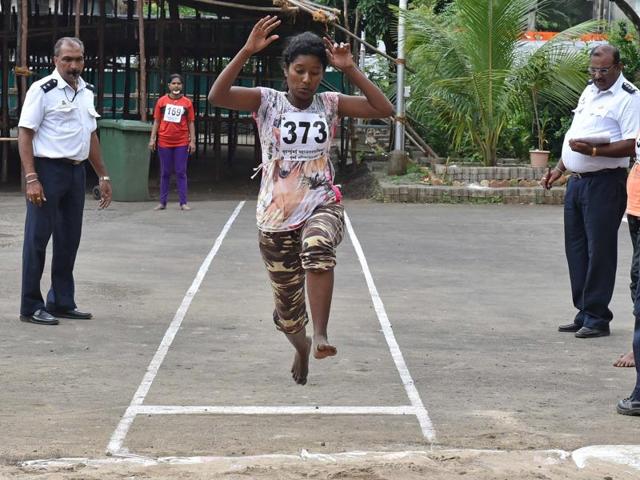A girl jumps during long jump event at Fire Brigade recruitment drive at Borivali. Candidates go through various physical tests during recruitment and get selected for training after the result of recruitment drive. After training for 6 months, 774 posts of firemen will get fulfilled through merit. (Pratham Gokhale)