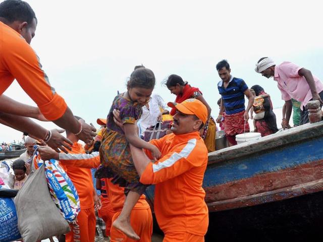 NDRF personnel take flood-affected people to safety in Nakta Diyara in Patna district. (PTI) NDRF personnel take flood-affected people to safety in Nakta Diyara in Patna district. (PTI)