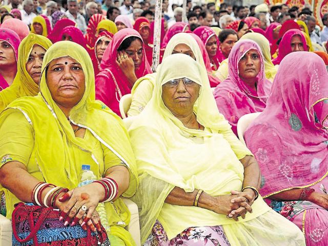 Gangster Anandpal Singh’s mother Nirmal Kanwar (centre) defended her son at a protest rally organised by the Ravana Rajput community at Vidyadhar Nagar stadium on Monday. Over 3,000 people had gathered in the state capital to protest against the regular harassment of the gangster’s family members by the police in the name of inquiry. (HT Photo) Gangster Anandpal Singh’s mother Nirmal Kanwar (centre) defended her son at a protest rally organised by the Ravana Rajput community at Vidyadhar Nagar stadium on Monday. Over 3,000 people had gathered in the state capital to protest against the regular harassment of the gangster’s family members by the police in the name of inquiry. (HT Photo)