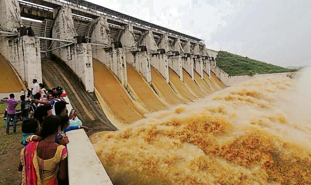 Gates at the Tenughat dam opened to release excess water at Tenughat, Bokaro on Monday.(HT Photo)