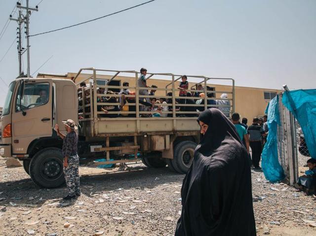 In this August 17, 2016 photo, a truck carrying civilians who recently fled territory formerly controlled by Islamic State militants arrives at at the Dibaga Camp for displaced people in Hajj Ali, northern Iraq.(AP)