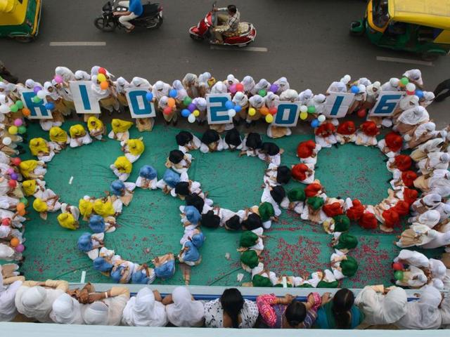 School children form the emblem of the Rio 2016 Summer Olympics in Ahmedabad.(AFP Photo)