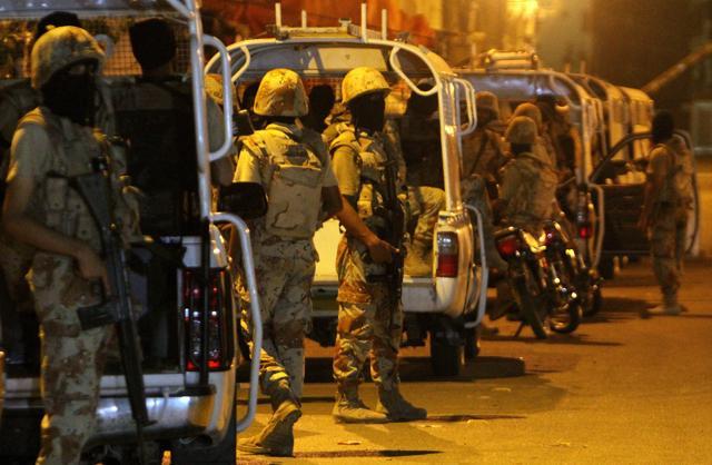 Soldiers cordon-off an area outside offices of the Muttahida Qaumi Movement, or MQM, in Karachi, Pakistan. (AP Photo) Soldiers cordon-off an area outside offices of the Muttahida Qaumi Movement, or MQM, in Karachi, Pakistan. (AP Photo)