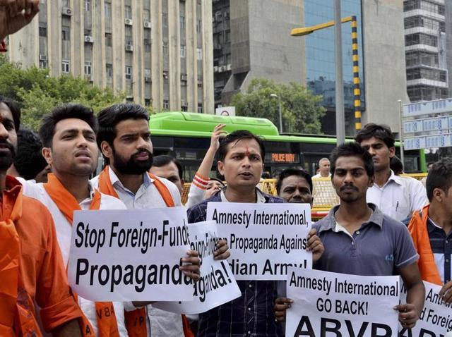 File photo of ABVP activists at a protest against Amnesty International India in New Delhi. A sedition case has been filed against the global rights group for hosting an event where alleged anti-India were raised. (PTI) File photo of ABVP activists at a protest against Amnesty International India in New Delhi. A sedition case has been filed against the global rights group for hosting an event where alleged anti-India were raised. (PTI)