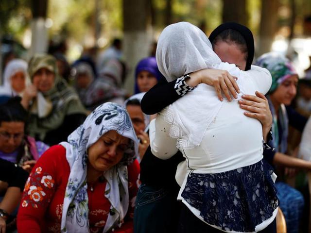 Relatives of Kumri Ilter, one of the victims of Saturday's suicide bombing at a wedding, mourn during her funeral ceremony in southeastern city of Gaziantep. (Reuters) Relatives of Kumri Ilter, one of the victims of Saturday's suicide bombing at a wedding, mourn during her funeral ceremony in southeastern city of Gaziantep. (Reuters)