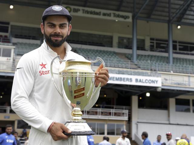 Virat Kohli and R Ashwin pose with the series trophy and the man of the series award at the Queen's Park Oval in Port-of-Spain, Trinidad, on Monday. India won the series 2-0. (AP) Virat Kohli and R Ashwin pose with the series trophy and the man of the series award at the Queen's Park Oval in Port-of-Spain, Trinidad, on Monday. India won the series 2-0. (AP)