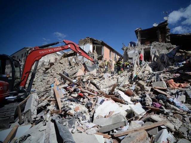 Rescuers and firemen inspect the rubble of buildings in Amatrice after a powerful earthquake rocked central Italy. (AFP Photo) Rescuers and firemen inspect the rubble of buildings in Amatrice after a powerful earthquake rocked central Italy. (AFP Photo)