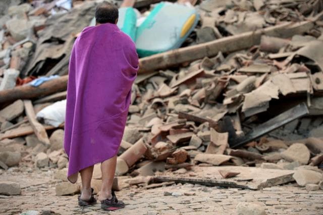 A man stands among the rubble of a house after a strong earthquake hit Amatrice. (AFP) A man stands among the rubble of a house after a strong earthquake hit Amatrice. (AFP)