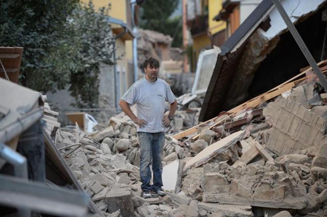 A man stands on a damaged home after a strong earthquake hit Amatrice. Numerous buildings collapsed in small communities close to the epicentre of the quake in a remote, thinly-populated area straddling the regions of Umbria, Marche and Lazio. (AFP) A man stands on a damaged home after a strong earthquake hit Amatrice. Numerous buildings collapsed in small communities close to the epicentre of the quake in a remote, thinly-populated area straddling the regions of Umbria, Marche and Lazio. (AFP)