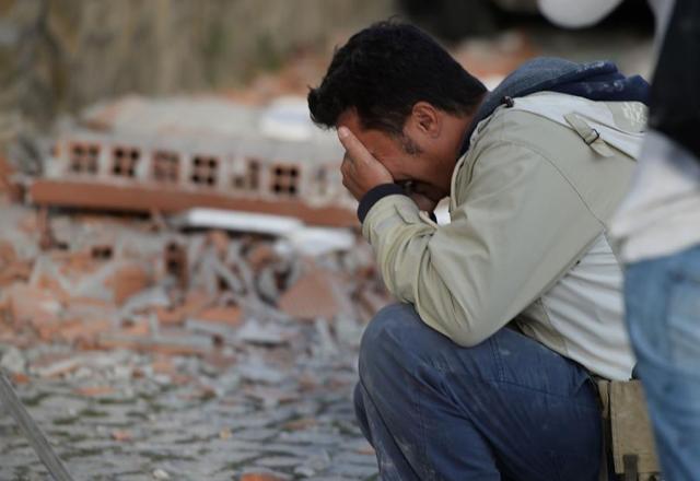 A man reacts after a strong earthquake hit Amatrice. (AFP) A man reacts after a strong earthquake hit Amatrice. (AFP)