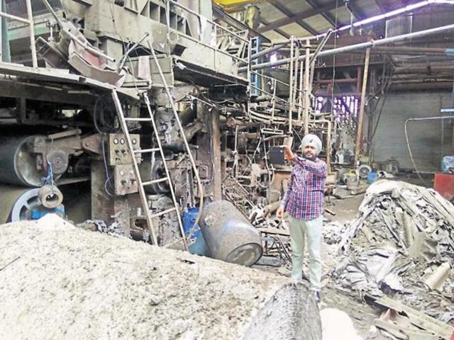 A man explaining the damage inside the paper factory where a blast in a boiler killed three labourers in Malerkotla, Sangrur district, on Monday. (HT File Photo) A man explaining the damage inside the paper factory where a blast in a boiler killed three labourers in Malerkotla, Sangrur district, on Monday. (HT File Photo)