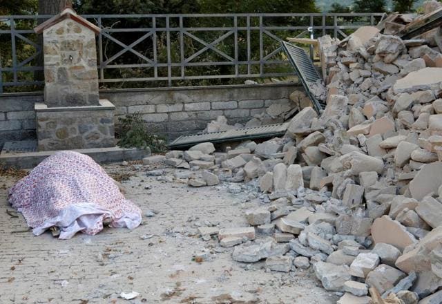 A body is covered by cloth next to rubble following a quake in Amatrice, central Ital (Reuters) A body is covered by cloth next to rubble following a quake in Amatrice, central Ital (Reuters)