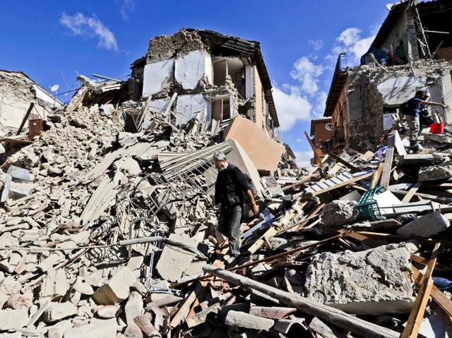 A man walks amid rubbles after an earthquake struck in Amatrice. (AP Photo)