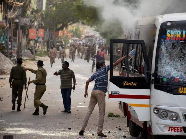 Supporters of Indigenous People's Front of Tripura (IPFT) vandalise a bus at a rally in Agartala on Tuesday. (PTI Photo) Supporters of Indigenous People's Front of Tripura (IPFT) vandalise a bus at a rally in Agartala on Tuesday. (PTI Photo)