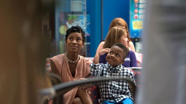 Zion Harvey raises his right arm while sitting next to his mother Pattie Ray during a news conference. (AP Photo) Zion Harvey raises his right arm while sitting next to his mother Pattie Ray during a news conference. (AP Photo)