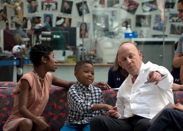 Zion Harvey sits next to his mother and holds hands with one of his surgeons, L Scott Levin (right) in Philadelphia. (AP Photo) Zion Harvey sits next to his mother and holds hands with one of his surgeons, L Scott Levin (right) in Philadelphia. (AP Photo)