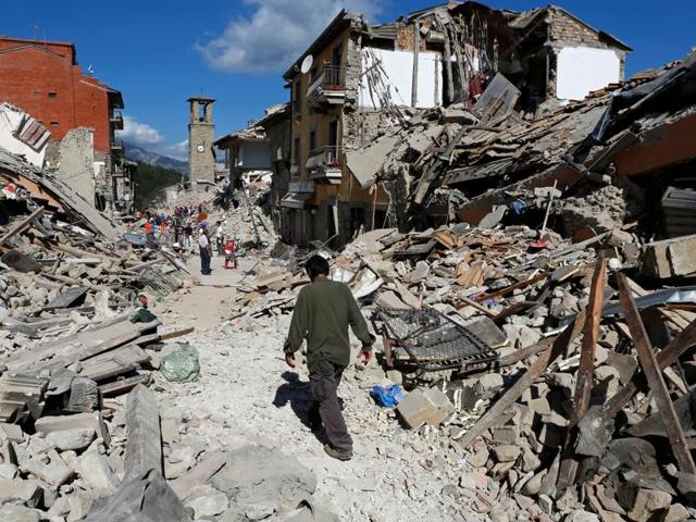 A man walks amidst rubble following an earthquake in Pescara del Tronto, central Italy. (REUTERS) A man walks amidst rubble following an earthquake in Pescara del Tronto, central Italy. (REUTERS)