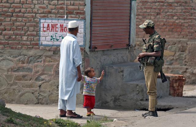 A boy gestures at a member of the security forces in Srinagar as the city remains under curfew following weeks of violence in Kashmir. (REUTERS) A boy gestures at a member of the security forces in Srinagar as the city remains under curfew following weeks of violence in Kashmir. (REUTERS)