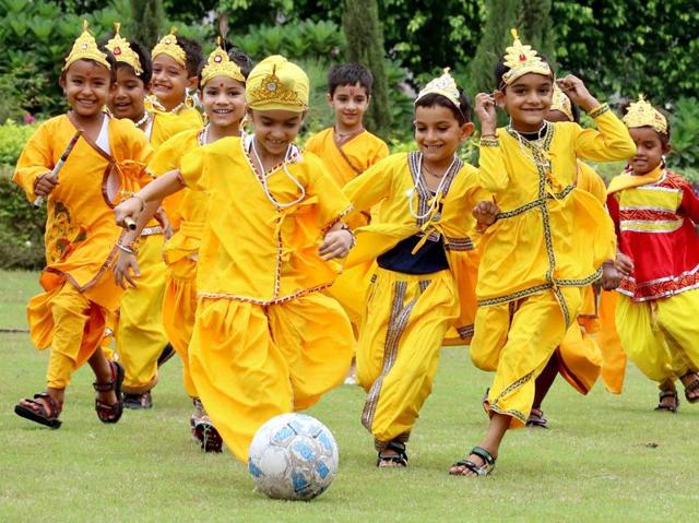 Gods’ field: Children dressed as Lord Krishna play football on the eve of Janmashtami in Patiala on Wednesday. (Bharat Bhushan/HT Photo)