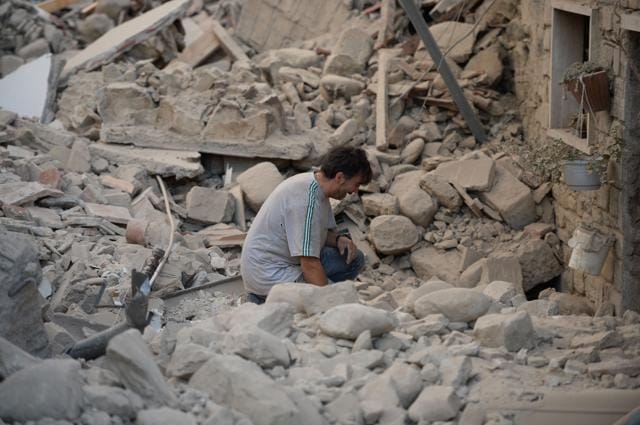 A man reacts to his damaged home after a strong earthquake hit Amatrice. (AFP Photo) A man reacts to his damaged home after a strong earthquake hit Amatrice. (AFP Photo)