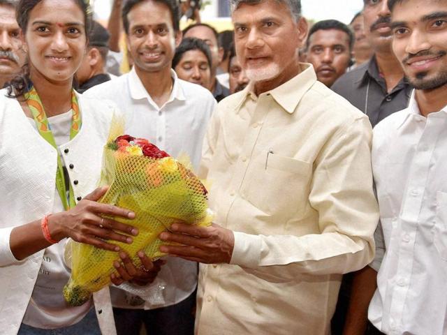 N Chandrababu Naidu poses for a photo with Sindhu, coach Pullela Gopichand and fellow player Srikanth Kidambi, who advanced to the quarterfinals of the men’s singles in Rio. (PTI) N Chandrababu Naidu poses for a photo with Sindhu, coach Pullela Gopichand and fellow player Srikanth Kidambi, who advanced to the quarterfinals of the men’s singles in Rio. (PTI)