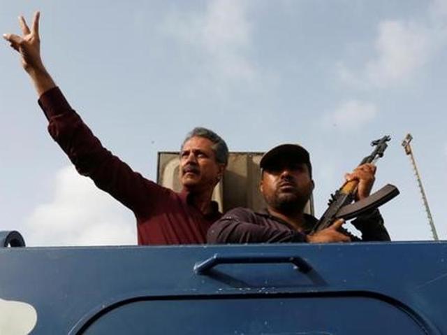 Waseem Akhtar, mayor nominee of Muttahida Qaumi Movement MQM, gestures from an armoured personal carrier while being taken to jail after his arrest in Karachi. (Reuters file photo) Waseem Akhtar, mayor nominee of Muttahida Qaumi Movement MQM, gestures from an armoured personal carrier while being taken to jail after his arrest in Karachi. (Reuters file photo)
