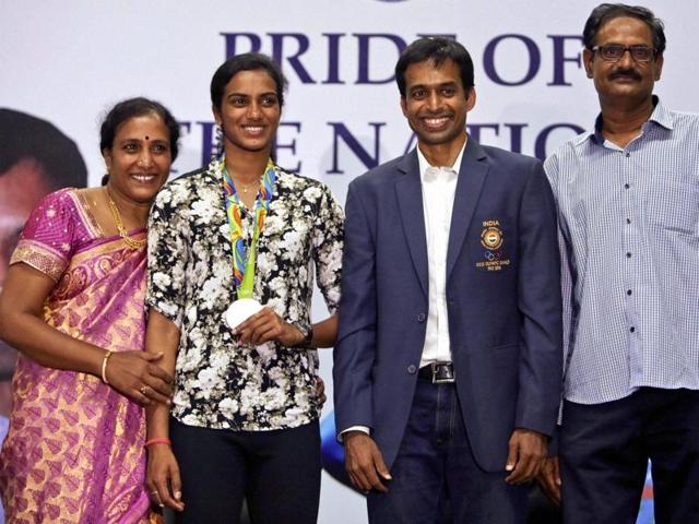 Sindhu, Gopichand, her mother P Vijaya and father PV Ramana during a reception at the Gopichand Academy in Hyderabad. (PTI) Sindhu, Gopichand, her mother P Vijaya and father PV Ramana during a reception at the Gopichand Academy in Hyderabad. (PTI)