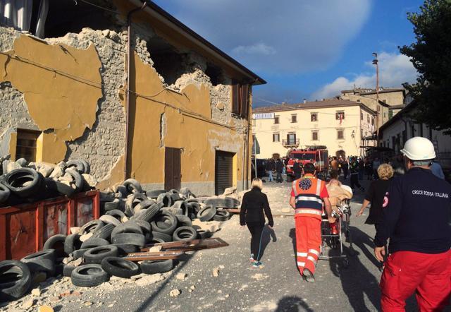 Rescuers and people walk along a road following an earthquake in Accumoli di Rieti, central Italy. (Reuters Photo) Rescuers and people walk along a road following an earthquake in Accumoli di Rieti, central Italy. (Reuters Photo)