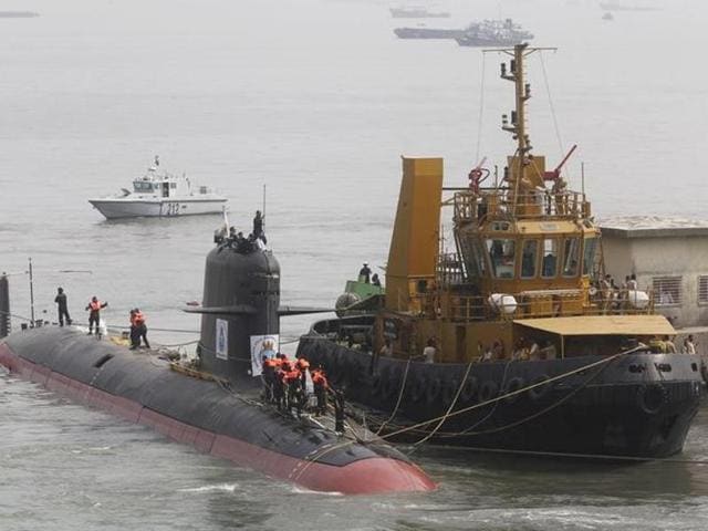 File photo of Indian Navy's Scorpene submarine INS Kalvari being escorted by tugboats as it arrives at Mazagon Docks Ltd, a naval vessel ship building yard, in Mumbai, October 29, 2015.(Reuters)