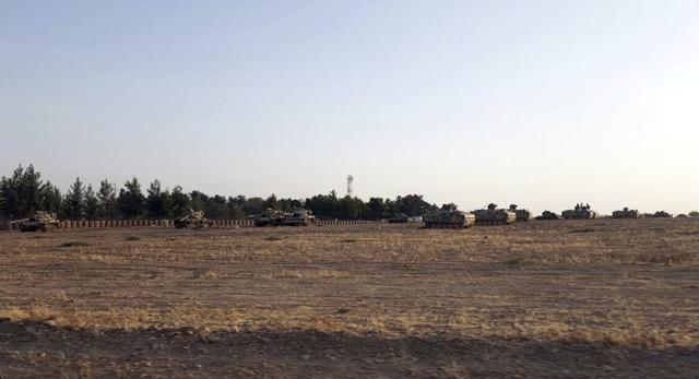 Turkish army tanks are stationed near the border with Syria in Karkamis (AP) Turkish army tanks are stationed near the border with Syria in Karkamis (AP)