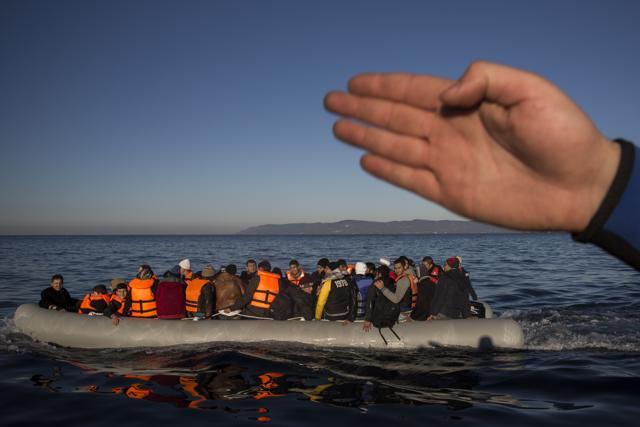 Refugees and migrants approach the Greek island of Lesbos on a dinghy as they cross the Aegean sea from the Turkish coast. (AP File Photo) Refugees and migrants approach the Greek island of Lesbos on a dinghy as they cross the Aegean sea from the Turkish coast. (AP File Photo)