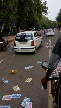 Campaigners moving around in cars randomly fling posters bearing the names of the candidates. Campaigners moving around in cars randomly fling posters bearing the names of the candidates.