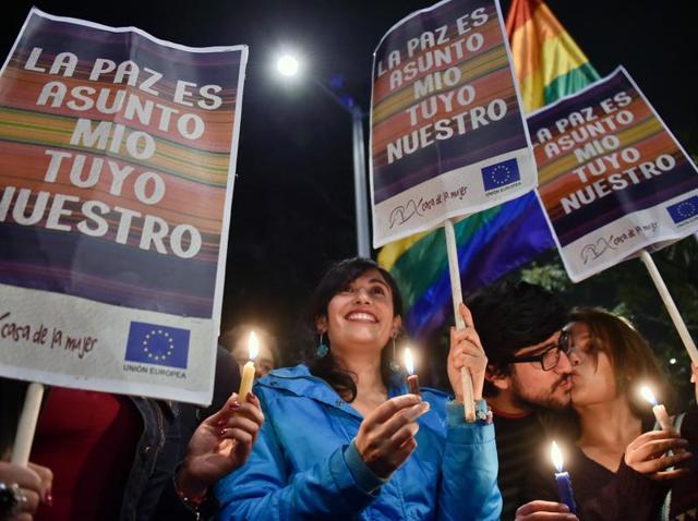 Colombians hold signs reading "Peace is my, your, our business" and celebrate in Bogota as they watch on a giant screen the signing of the agreement at the conclusion of the peace talks between the government and the FARC. (AFP Photo) Colombians hold signs reading "Peace is my, your, our business" and celebrate in Bogota as they watch on a giant screen the signing of the agreement at the conclusion of the peace talks between the government and the FARC. (AFP Photo)