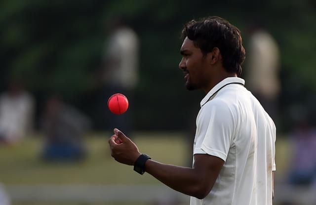 'India Green' bowler Sandeep Sharma tosses the pink ball during a Duleep Trophy cricket match. (AFP Photo) 'India Green' bowler Sandeep Sharma tosses the pink ball during a Duleep Trophy cricket match. (AFP Photo)