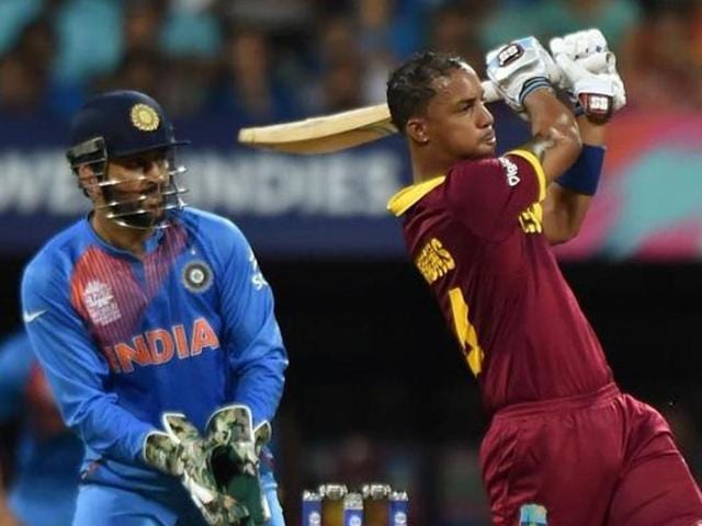 West Indies batsman Lendl Simmons(R)is watched by India's captain Mahendra Singh Dhoni. (AFP Photo) West Indies batsman Lendl Simmons(R)is watched by India's captain Mahendra Singh Dhoni. (AFP Photo)
