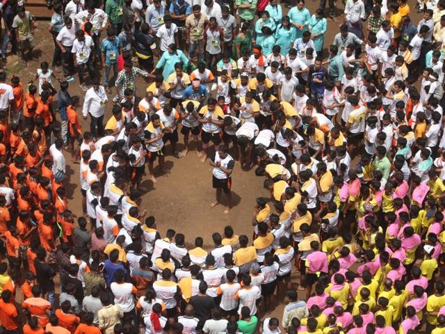 Govindas form a human pyramid at the Bhagwati School ground in Thane on Thursday. (praful gangurde/ht) 