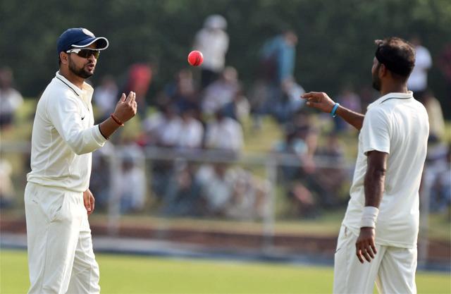 India Green's Suresh Raina passes the ball to bowler to A Dinda in the Duleep Trophy. (PTI Photo) India Green's Suresh Raina passes the ball to bowler to A Dinda in the Duleep Trophy. (PTI Photo)
