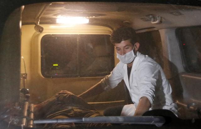 A wounded man lies inside an ambulance following an attack at the American University in Kabul. (Reuters Photo) A wounded man lies inside an ambulance following an attack at the American University in Kabul. (Reuters Photo)