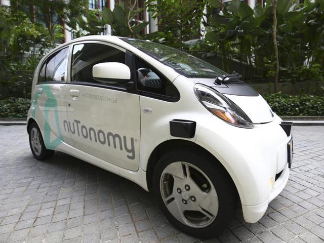 A nuTonomy self-driving taxi drives on the road in its public trial in Singapore on Thursday. (Reuters) A nuTonomy self-driving taxi drives on the road in its public trial in Singapore on Thursday. (Reuters)