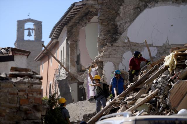 Volunteers work to move rubble and debris during search and rescue operations in Amatrice. (AFP) Volunteers work to move rubble and debris during search and rescue operations in Amatrice. (AFP)