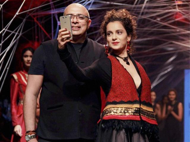 Bollywood actress Kangana Ranaut had some runway fun with Fashion designer Tarun Tahiliani at the opening show on Tuesday. Kangana donned one of his creations - a black satin skirt, paired with a black top and an embellished jacket. (PTI) Bollywood actress Kangana Ranaut had some runway fun with Fashion designer Tarun Tahiliani at the opening show on Tuesday. Kangana donned one of his creations - a black satin skirt, paired with a black top and an embellished jacket. (PTI)