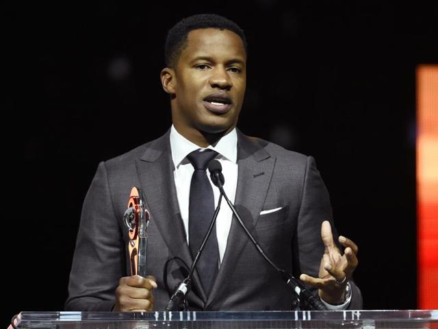 In this April 14, 2016 file photo, Nate Parker, director of the upcoming film The Birth of a Nation, accepts the Breakthrough Director of the Year award during the CinemaCon 2016 Big Screen Achievement Awards in Las Vegas. The American Film Institute has canceled plans to screen writer-director Nate Parker’s movie for students this week amid controversies surrounding a 17 year old rape accusation of Parker and his co-writer. (AP) In this April 14, 2016 file photo, Nate Parker, director of the upcoming film The Birth of a Nation, accepts the Breakthrough Director of the Year award during the CinemaCon 2016 Big Screen Achievement Awards in Las Vegas. The American Film Institute has canceled plans to screen writer-director Nate Parker’s movie for students this week amid controversies surrounding a 17 year old rape accusation of Parker and his co-writer. (AP)