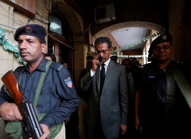 Waseem Akhtar of the Muttahida Qaumi Movement (MQM) escorted by placemen after the ballot for mayor at the Municipal Corporation Building in Karachi on Wednesday. (Reuters) Waseem Akhtar of the Muttahida Qaumi Movement (MQM) escorted by placemen after the ballot for mayor at the Municipal Corporation Building in Karachi on Wednesday. (Reuters)