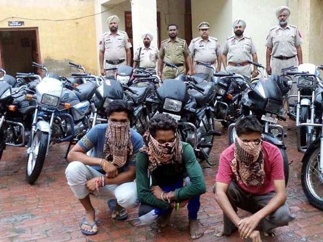Arrested members of the gang with the stolen motorcycles at Sadar police station in Tarn Taran on Wednesday.(HT Photo)
