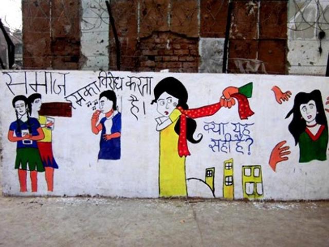 A wall painting by volunteers taking part in Gender Mela, depicting various restrictions and fears a woman faces on a daily basis.