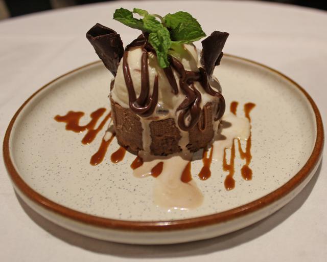 Texture of caramel is not an Asian dessert, but is a delightful stack of hazelnut praline crumble, caramel, sea salt, cream, and milk chocolate mousse. (Satyabrata Tripathy / HT Photo)