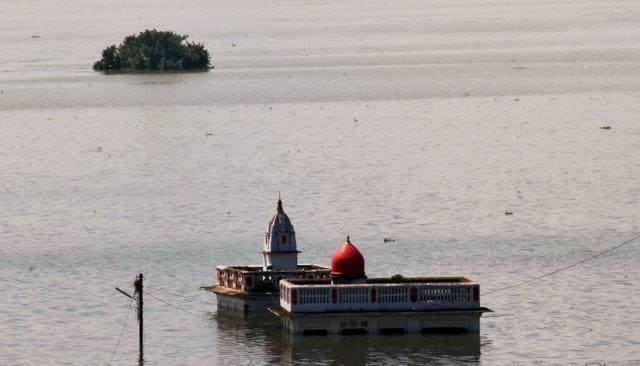Temple submerged in water of river Ganga in Allahabad on Friday. (PTI) Temple submerged in water of river Ganga in Allahabad on Friday. (PTI)