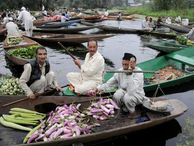 A vendor sells vegetables at Dal Lake’s floating market, in Srinagar on Wednesday.(Waseem Andrabi/HT Photo) A vendor sells vegetables at Dal Lake’s floating market, in Srinagar on Wednesday.(Waseem Andrabi/HT Photo)