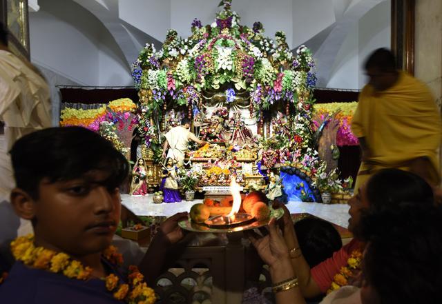 Fevotees pray at the ISKCON Temple, which marks its 50th year, near Greater Kailash in New Delhi on Thursday. (Sushil Kumar/HT Photo) Fevotees pray at the ISKCON Temple, which marks its 50th year, near Greater Kailash in New Delhi on Thursday. (Sushil Kumar/HT Photo)